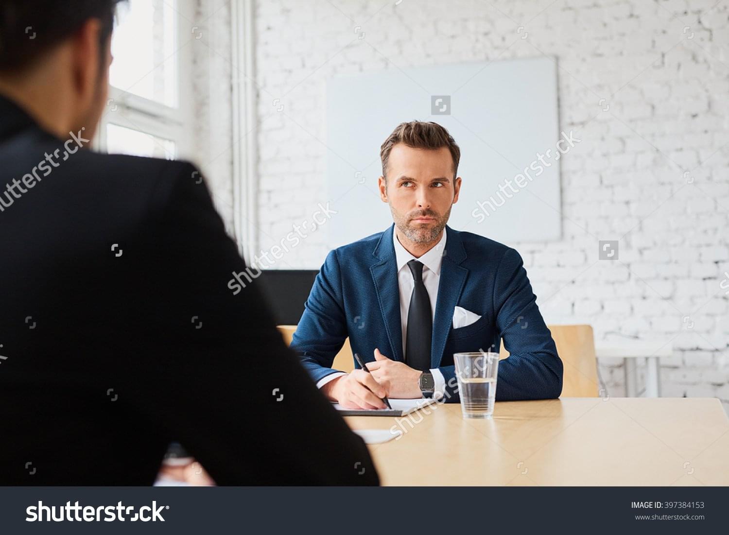 stock-photo-job-interview-businessman-listen-to-candidate-answers-397384153